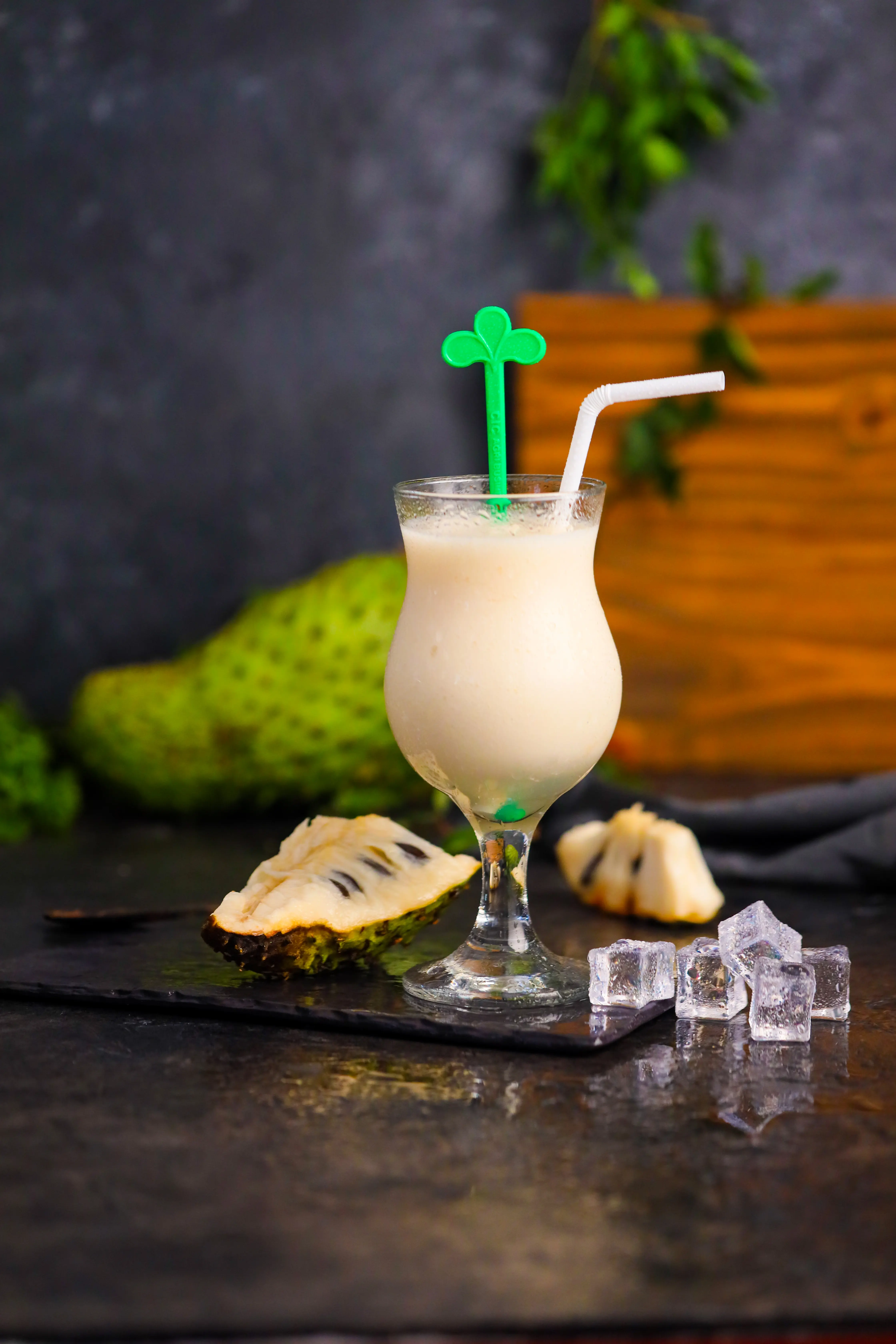 CIC Fresheez Soursop Fruit juice in  a juice glass with a straw