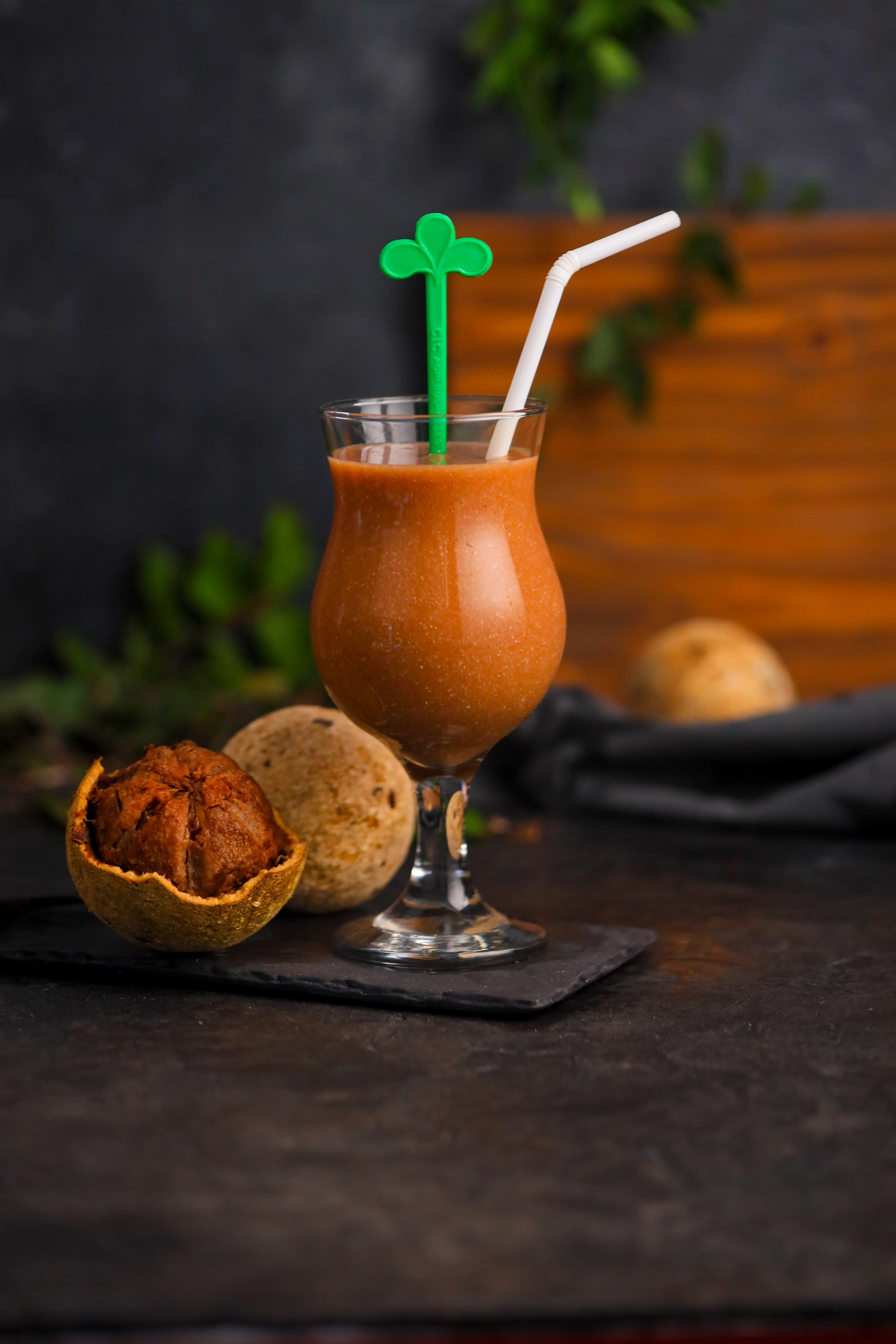 CIC Fresheez Wood apple juice in a juice glass with a straw