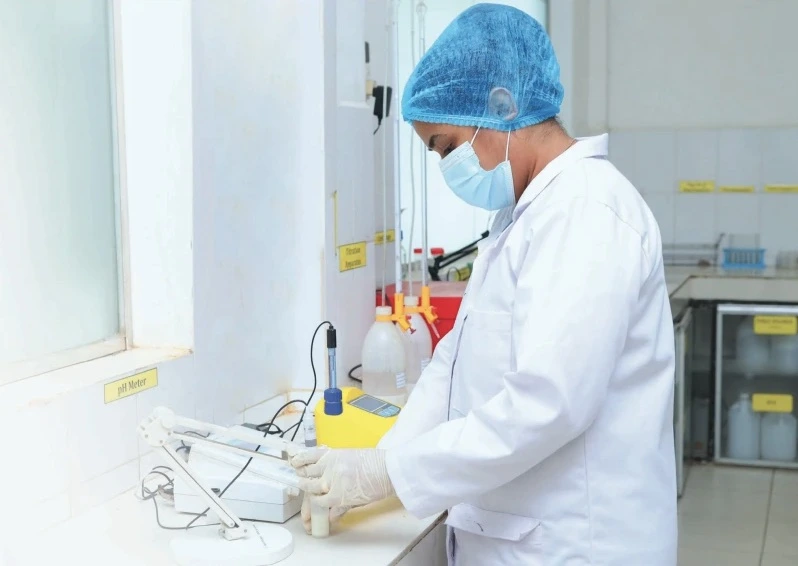 A Lab employee checking the quality of milk for CIC Creamoo Dairy Products