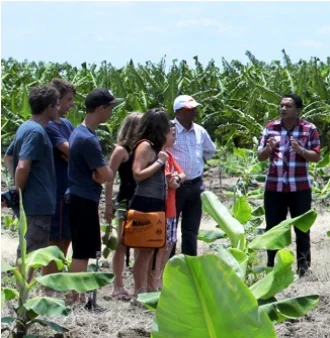 A nature guide at CIC agri resort explaining details for guests